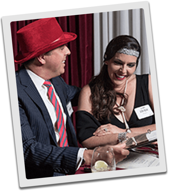 Atlanta Murder Mystery couple checking out the dinner menu